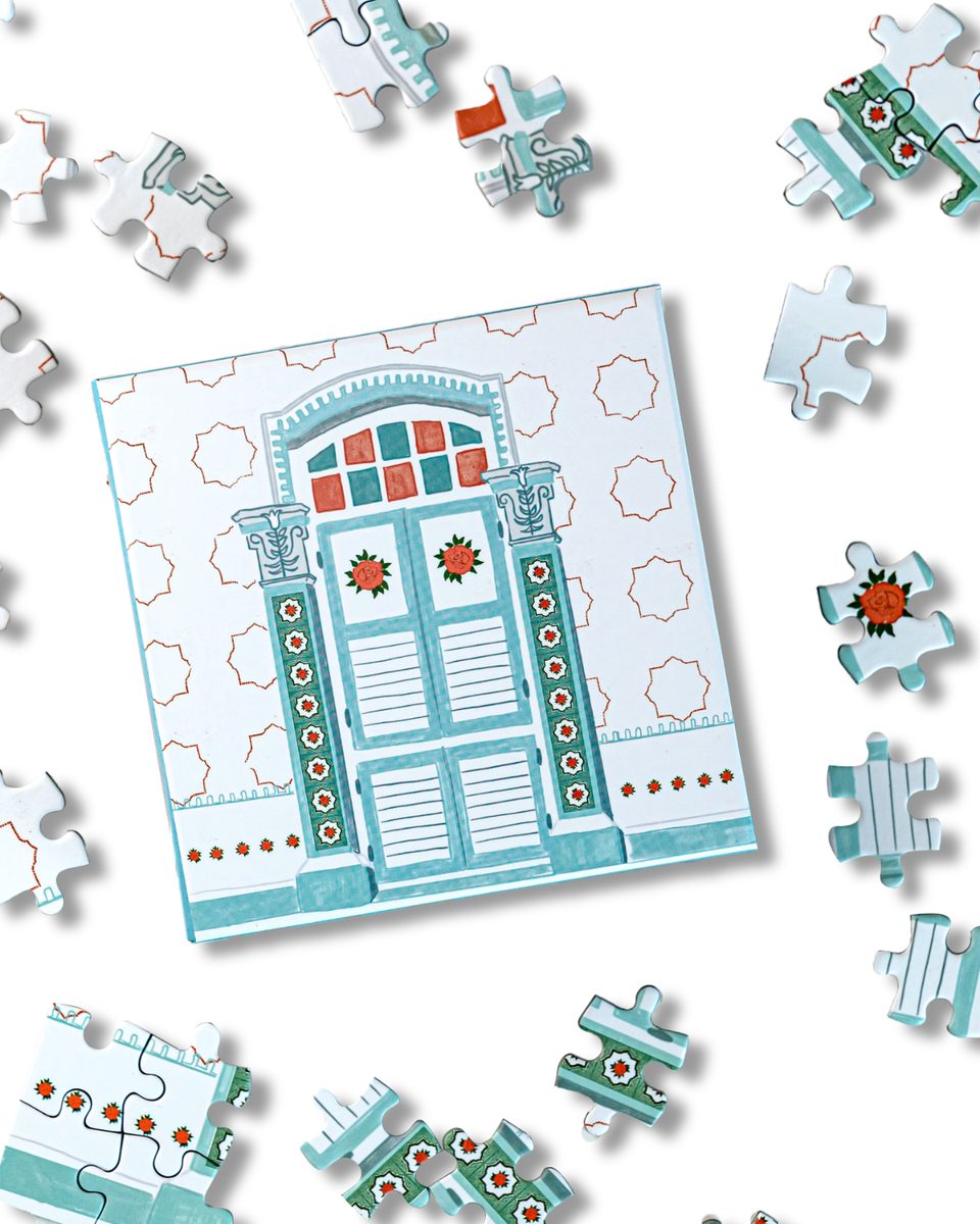 Blue door puzzle with scattered pieces