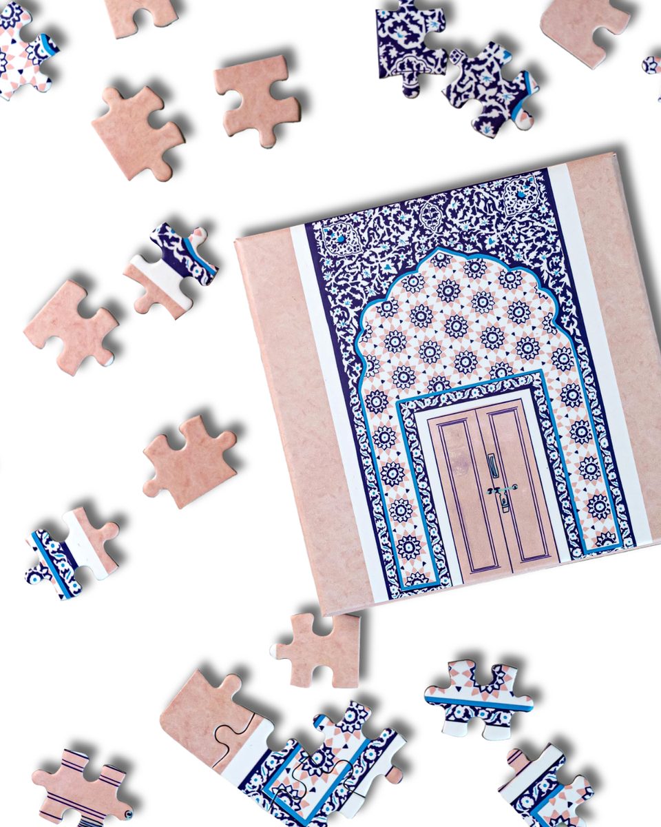 Pink door puzzle with scattered pieces