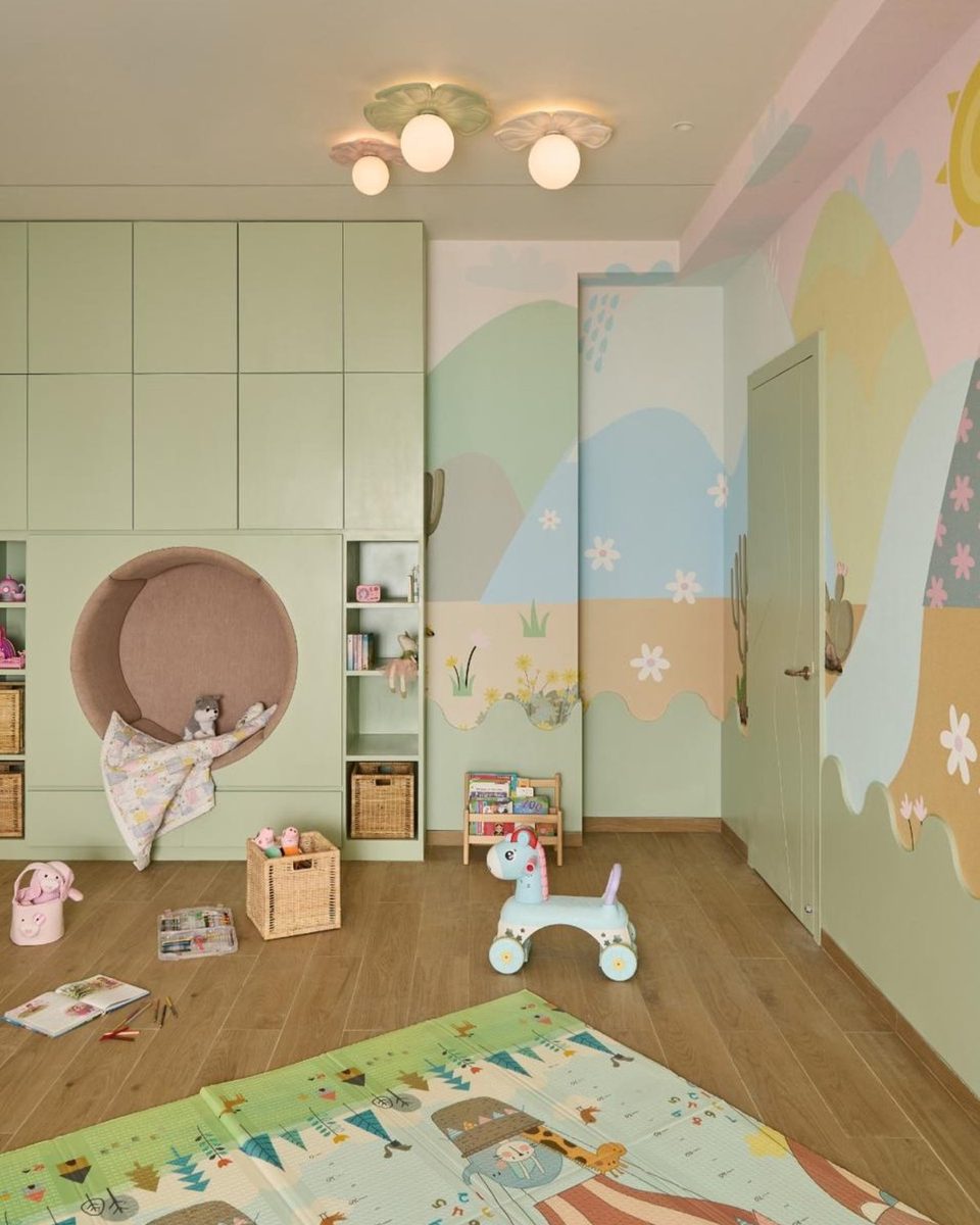 Hand-painted playroom wall mural with cactus and floral scene