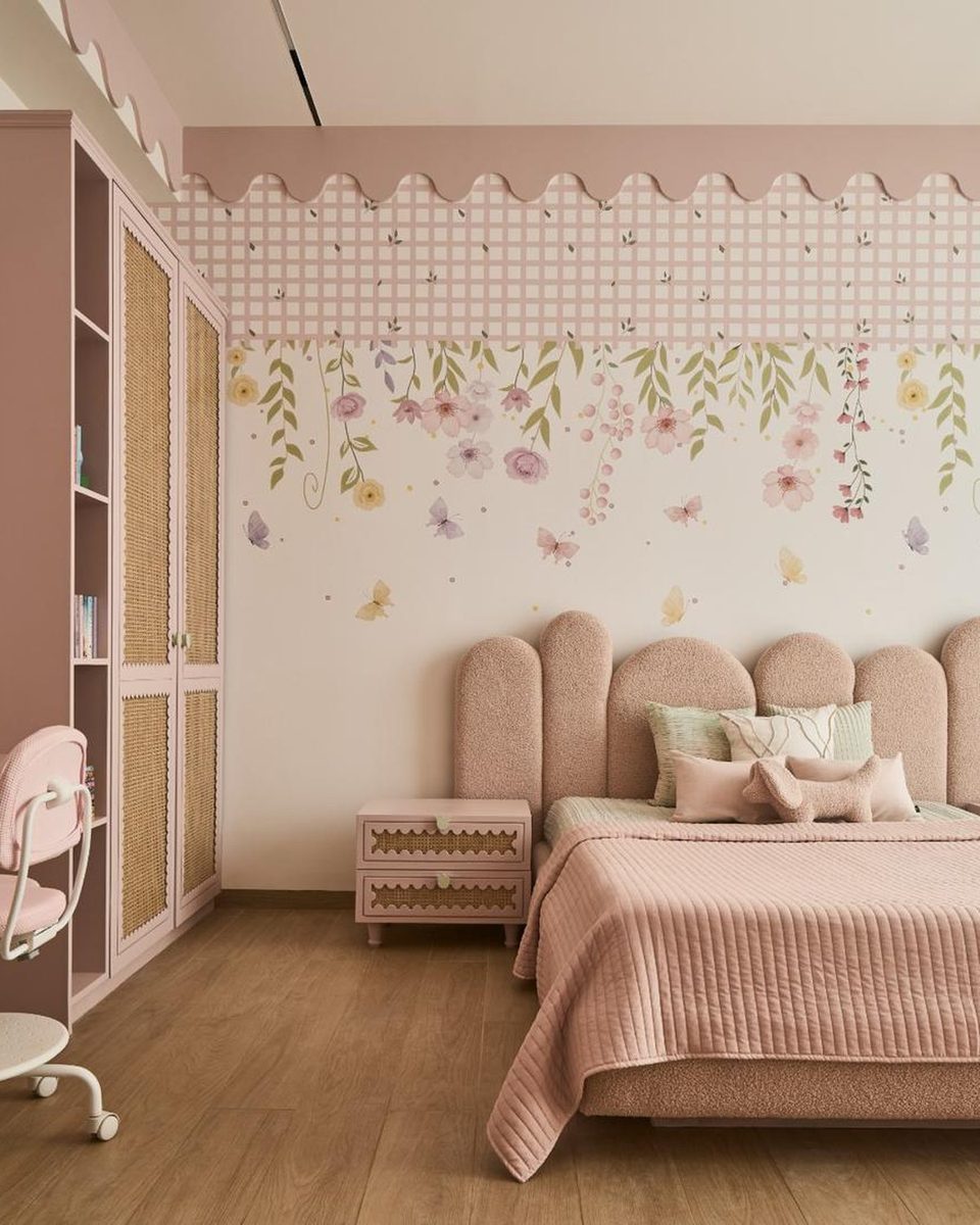Floral wallpaper panel in a pink bedroom with a scalloped border