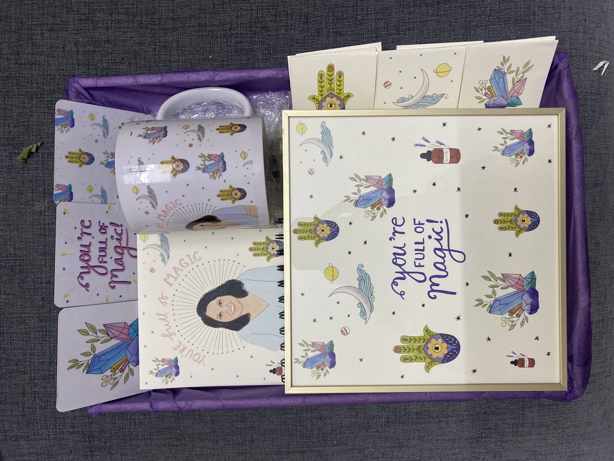 Prints, cards and a mug boxed together