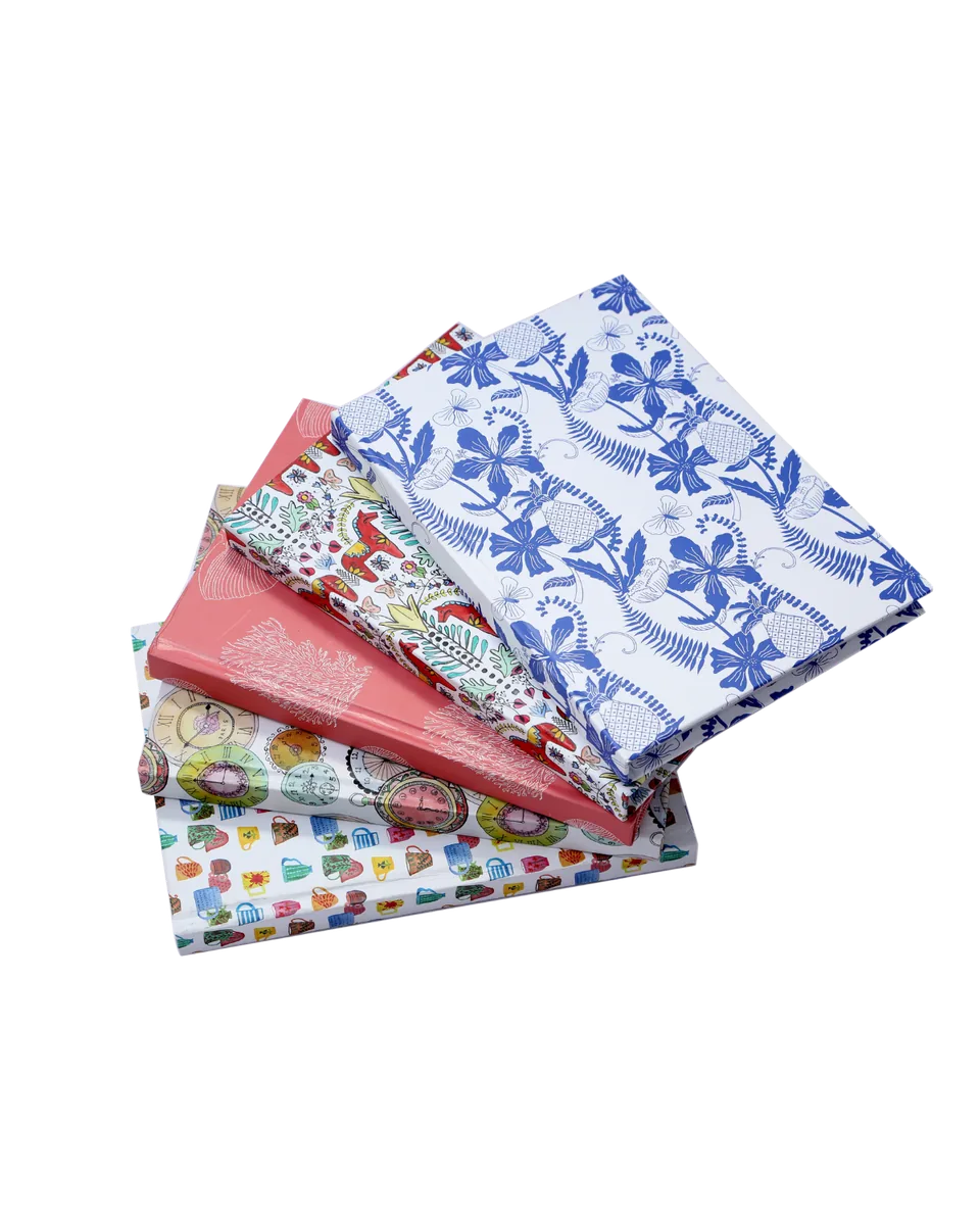 Hardbound notebooks, printed covers fanned out